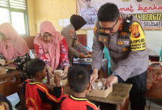  Polres Lamsel Bagikan Makan Bergizi Gratis 